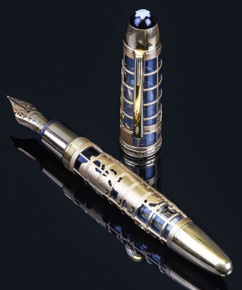 Inline Image - John Harrison, 333, limited edition gold coloured skeleton fountain pen, 
no. 020/333, circa 2002, stamped 750 with common control mark, 
the barrel set with a diamond, the cap with a clip, the gold coloured nib stamped 18K 750, piston filling system, inked, est. £6,000-8,000 (+fees)