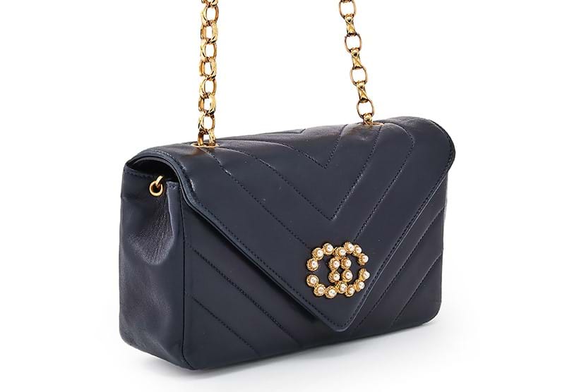 Inline Image - Chanel, a navy lambskin chevron quilted Flap handbag, circa 1991-1994 | Sold for £882