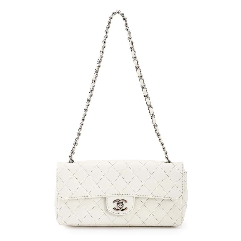 Inline Image - Chanel, East West, a white caviar leather quilted classic Flap handbag, circa 2010 | Sold for £2,142