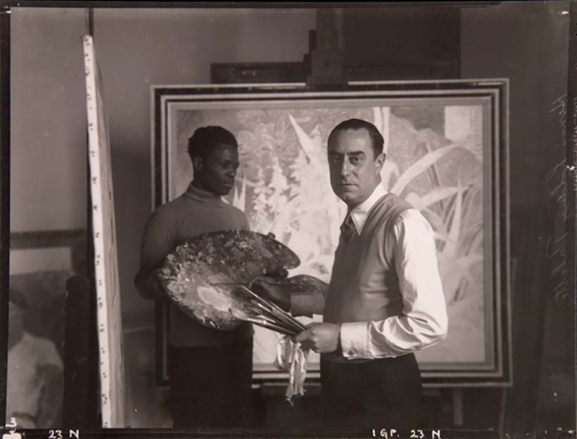 Inline Image - Philpot and his Jamaican model Henry Thomas in his studio at Baynards Manor in front of Garden in Nice (Floodlight), 1934 - later owned by Syrie Maugham. Photograph by W.H. Grove & Son.