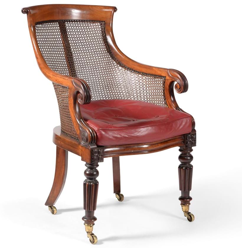 Inline Image - Lot 199: A George IV mahogany bergere library armchair, circa 1825, Est. £600-800 (+fees) | Fine Furniture, Sculpture, Carpets and Ceramics