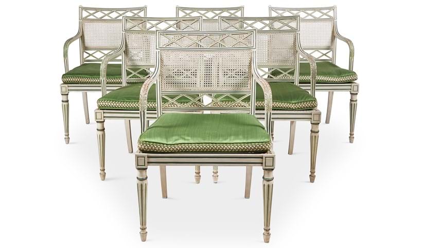 Inline Image - Lot 70: A set of eighteen cream and green painted dining chairs, designed by Oliver Messel, made by Victor Afia | Sold for £30,000